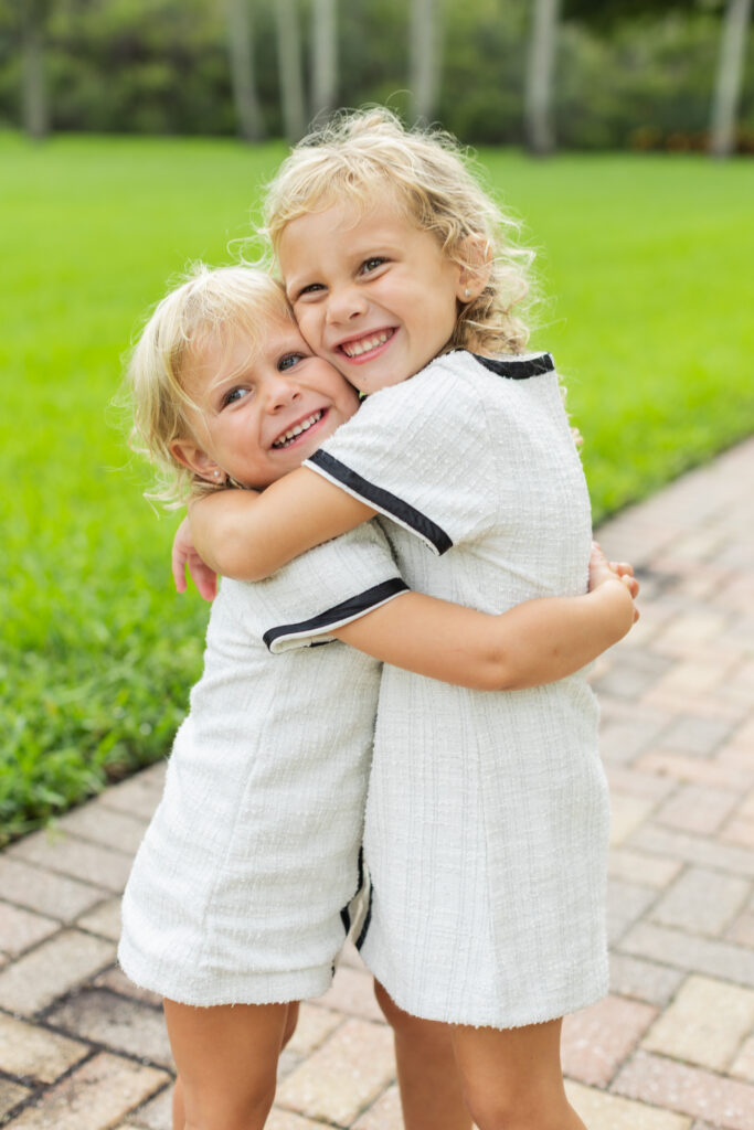 Sisters together during family photo session in Wellington, Florida