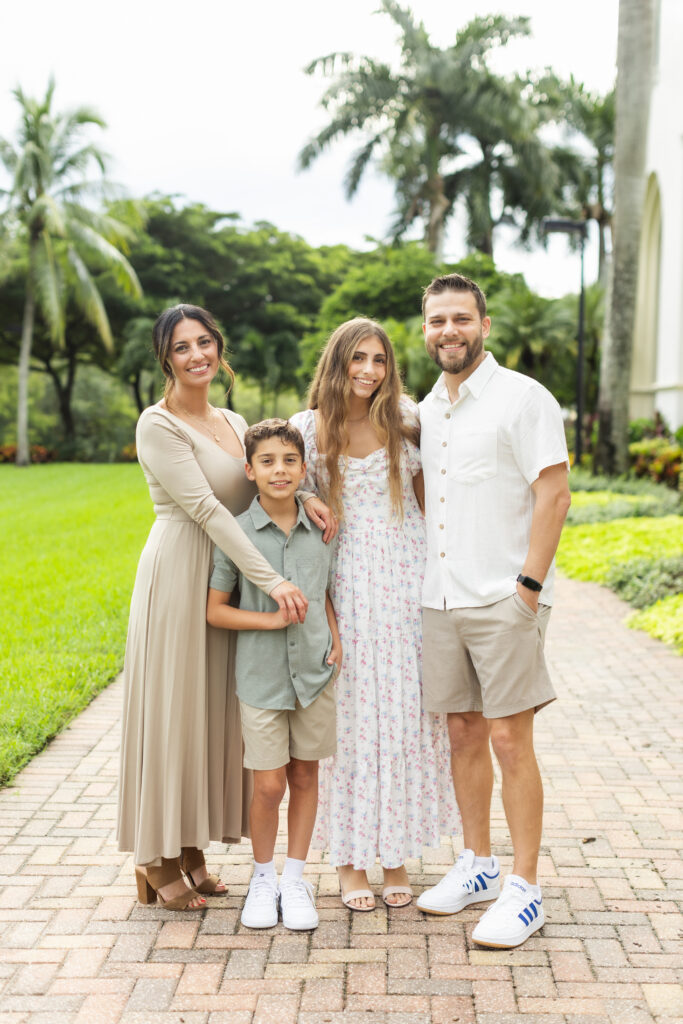 Family laughing together during Palm Beach family photo session