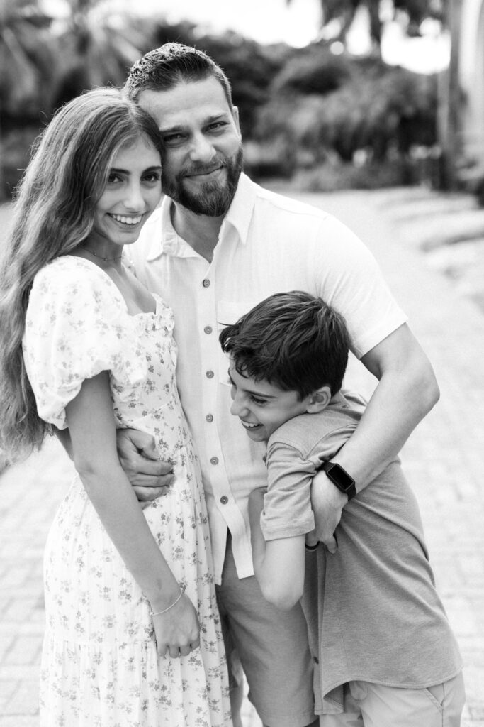 Father with children during family portrait session in Palm Beach