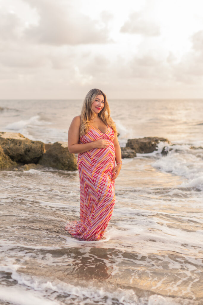 Expecting mother photographed at sunrise on Worth Avenue in Palm Beach