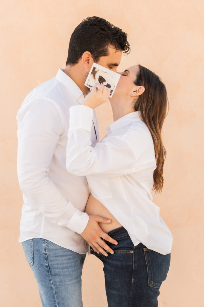 Expecting parents photographed together during their Palm Beach maternity session