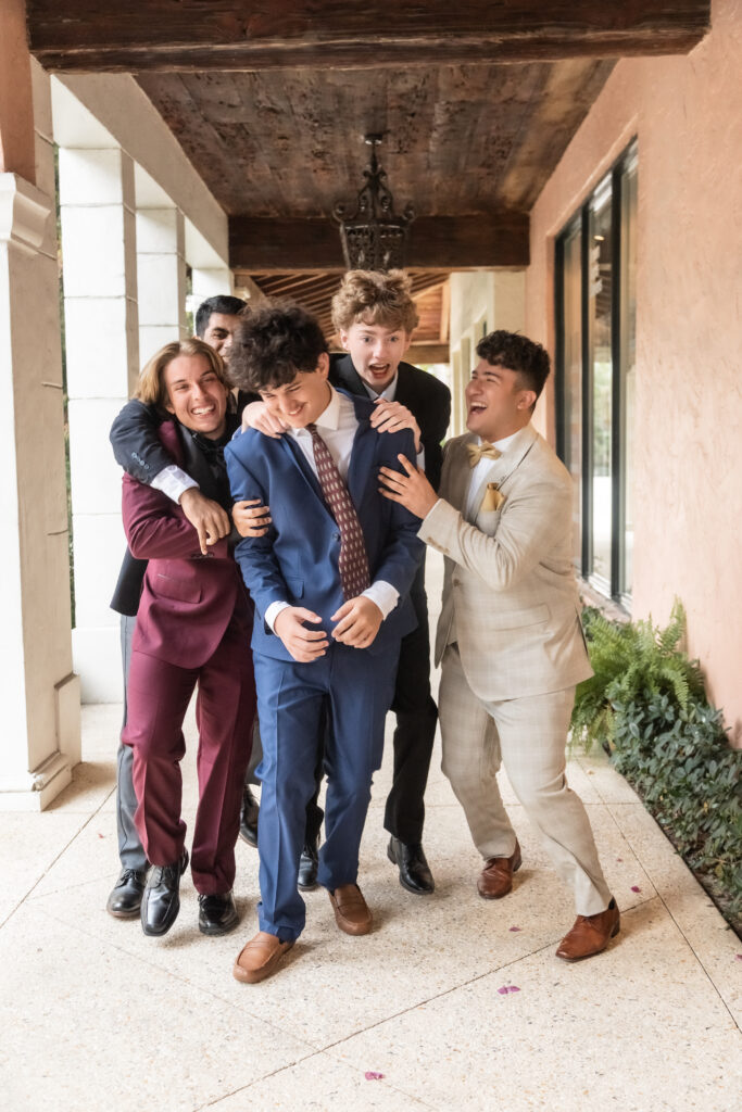 High school seniors laughing together during a Worth Avenue photoshoot